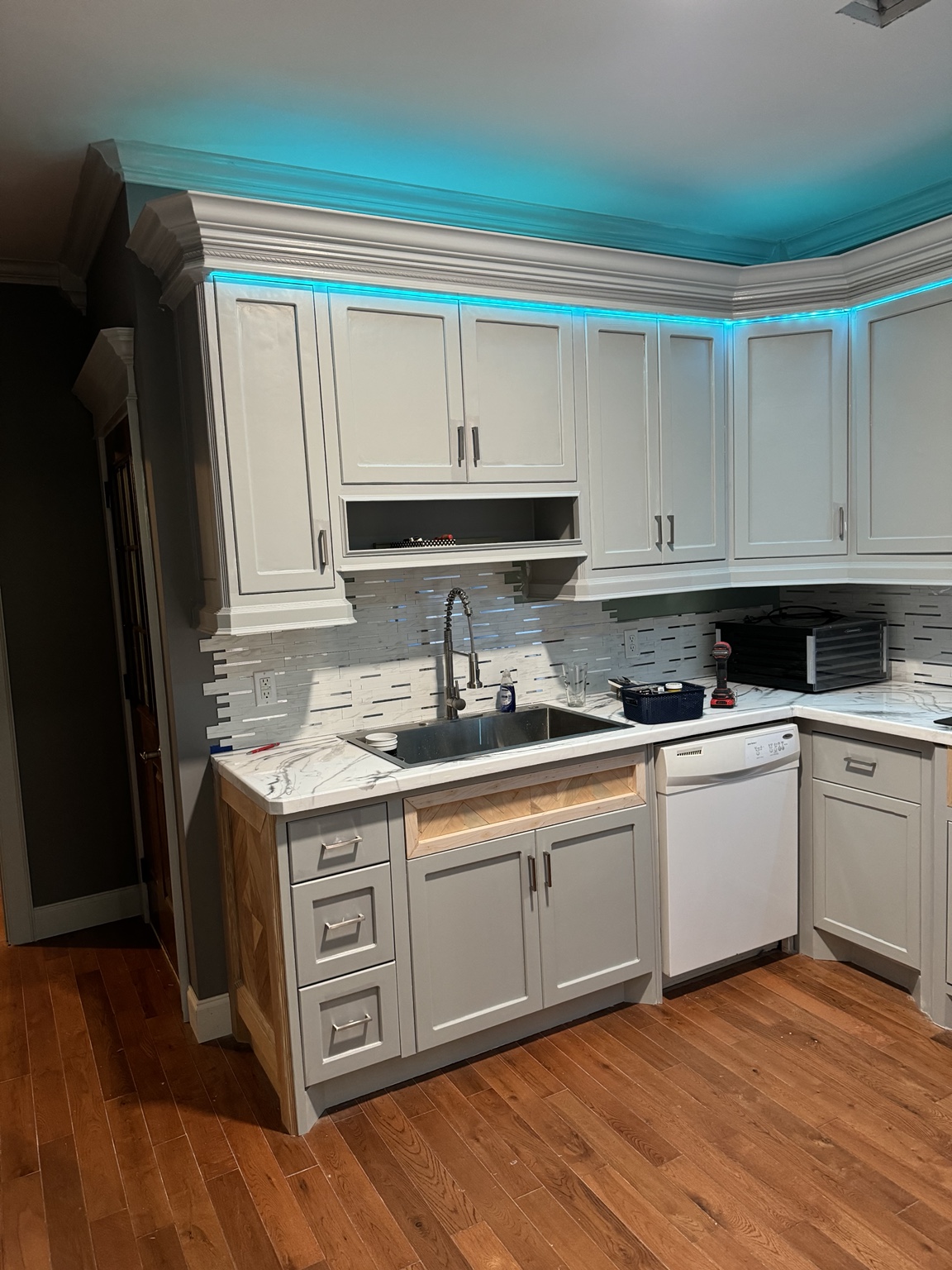 Kitchen with custom crown molding and LED accent lighting